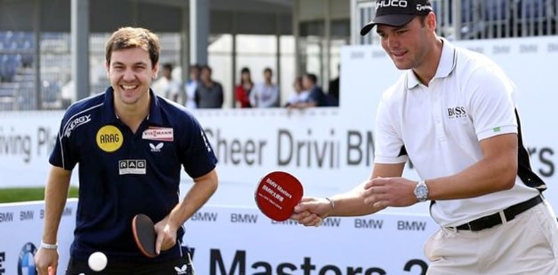 Kaymer im Tischtennis-Duell mit Timo Boll