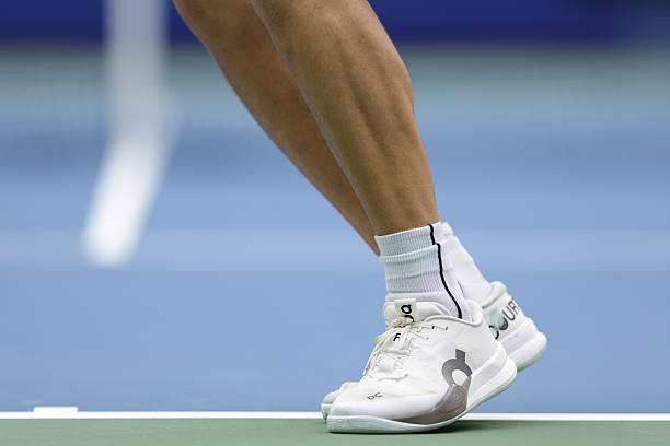 Close-up of Ben Shelton's shoes during his serve against Alexander Zverev.