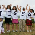 A group of children show their support f