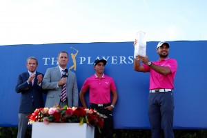 PONTE VEDRA BEACH, FL - MAY 15: Rickie Fowler (2ndR) of the United States presents the trophy to Jason Day (R) of Australia after Day won the final round of THE PLAYERS Championship at the Stadium course at TPC Sawgrass on May 15, 2016 in Ponte Vedra Beach, Florida. (Photo by Richard Heathcote/Getty Images)